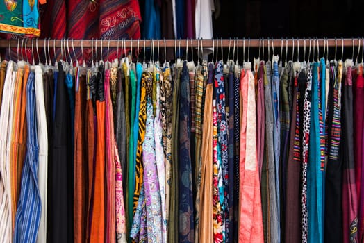 Colorful female clothing hanging in a shop