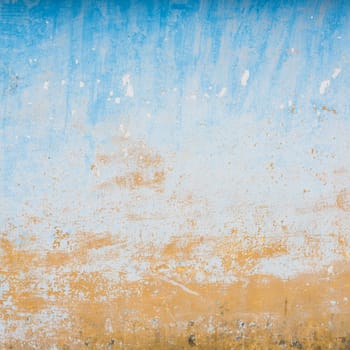 Dilapidated beige and blue wall texture, grungy background