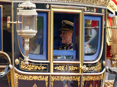 London, UK. May 8th, 2013. Queen Elizabeth II and Prince Philip leaving Buckingham Palace and going to the State Opening of Parliament.