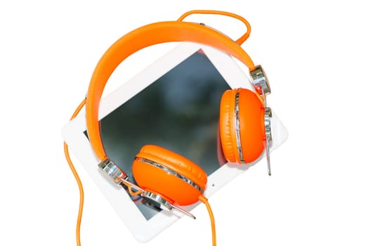 White tablet PC and orange headphones isolated on white