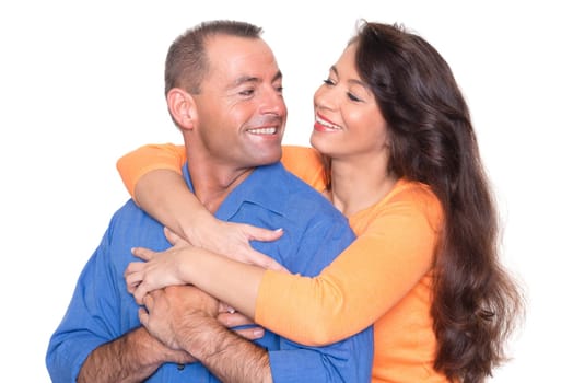 Happy middle-aged couple against a white background
