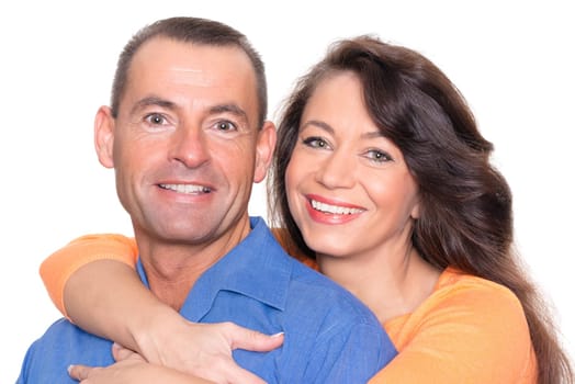 Happy middle-aged couple against a white background