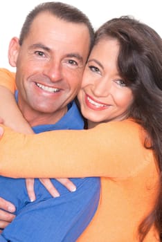 Happy middle-aged couple against a white background