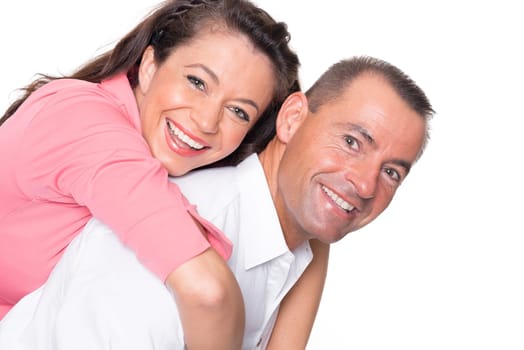 Happy middle-aged couple against a white background