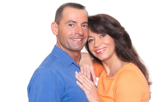 Happy middle-aged couple against a white background
