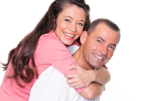 Happy middle-aged couple against a white background