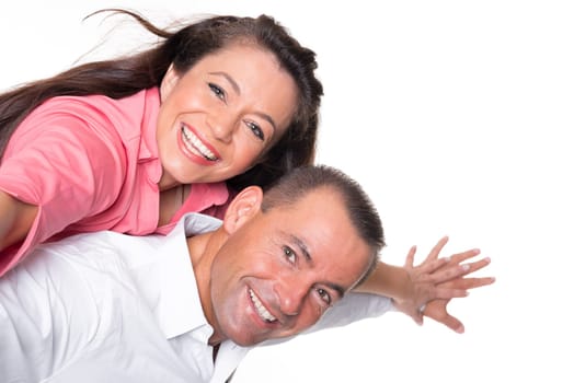 Happy middle-aged couple against a white background