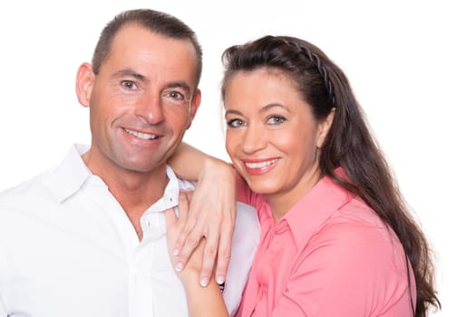 Happy middle-aged couple against a white background