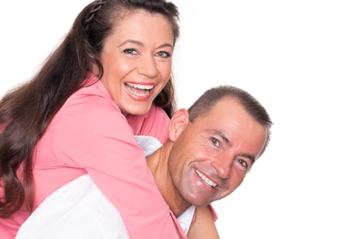 Happy middle-aged couple against a white background