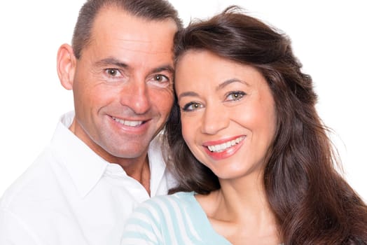 Happy middle-aged couple against a white background