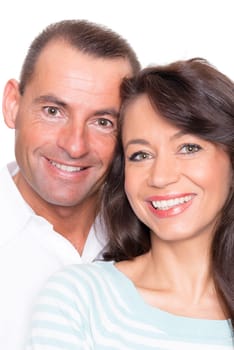Happy middle-aged couple against a white background