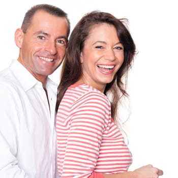 Happy middle-aged couple against a white background