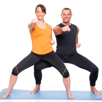 Sporty couple against a white background