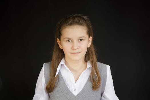 portrait of a girl with a white blouse and a gray vest