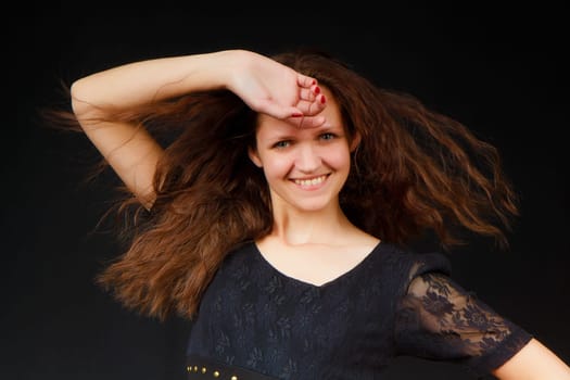 sexy girl with flowing long hair on a black background