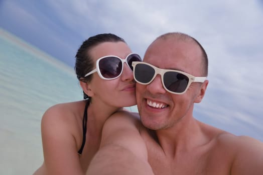 happy young couple relax and take fresh drink at summer vacation