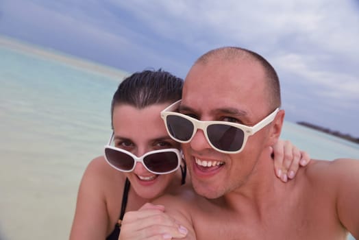 happy young couple relax and take fresh drink at summer vacation