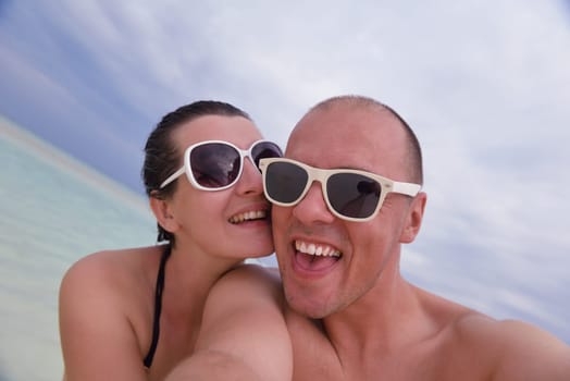 happy young couple relax and take fresh drink at summer vacation