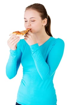 young woman eating pizza. isolated on white.