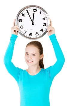 happy young woman holding office clock,isolated on white background