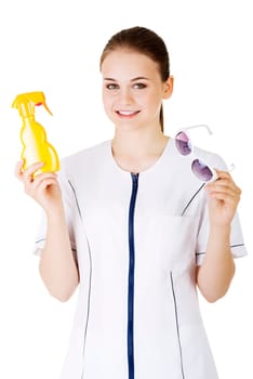 young female doctor or nurse showing sunscreen and sun glasses photo sun uv protection. isolated on white