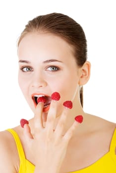 smiling casual woman with raspberries,isolated on white.