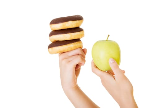 donut or green apple - hard choice. diet concept.