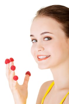 smiling casual woman with raspberries,isolated on white.