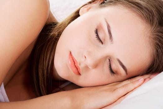 young beautiful woman sleeping on bed