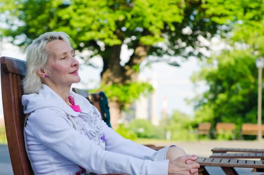 Portrait of a woman relaxing at a table summer Cafe