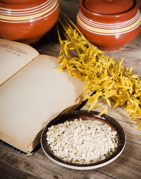 Still life with oatmeal and an open book