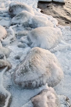 The marine stones covered by an ice, close up