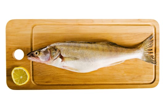 Pike perch on a wooden kitchen board, it is isolated on white