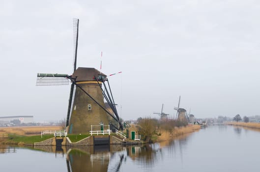 typical dutch windmills at Kinderdijk, Netherlands. A system of 19 windmills was built around 1740 to drain the polder. This group of mills is the largest concentration of old windmills in the Netherlands. The windmills of Kinderdijk are one of the best known Dutch tourist sites. They have been a UNESCO World Heritage Site since 1997.