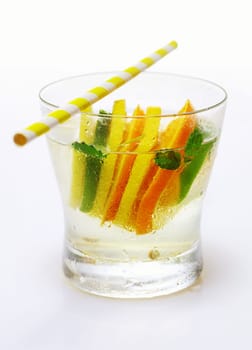 Tropical citrus cocktail with vodka garnished with alternating slices of lemon and orange served with a straw