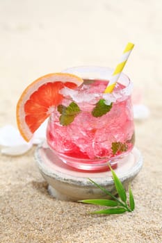 Tropical daiquiri cocktailv served in a tumbler of crushed ice for a refreshing party celebration on a summer vacation