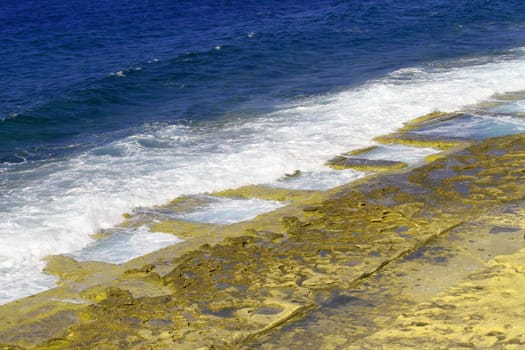 Rocky natural pools in the beach