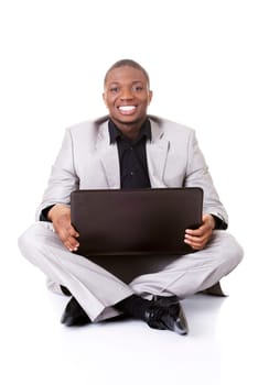 Successful businessman working on laptop, isolated on white