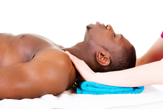 Man receiving massage at spa saloon