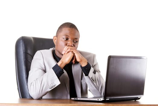 Stressed businessman working on laptop, isolated on white