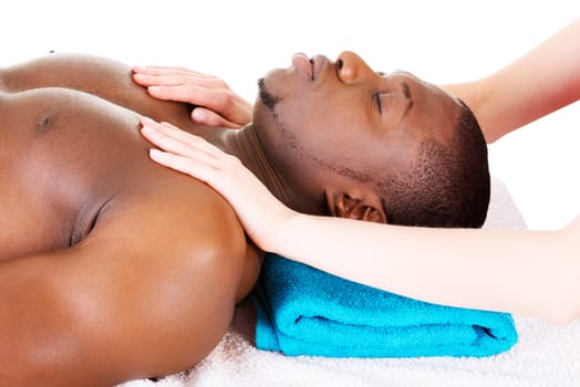 Man receiving massage at spa saloon
