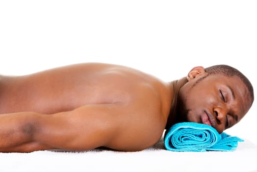 Man receiving massage at spa saloon