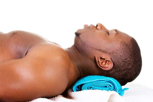 Man receiving massage at spa saloon