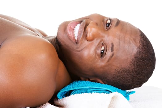 Man receiving massage at spa saloon
