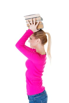 Young caucasian woman (student) with bookd on her head