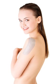 Beautiful face of spa woman with healthy clean skin and clay mask on arm. Isolated on white.