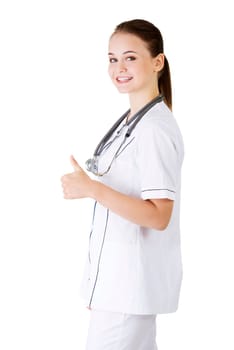 Young female doctor or nurse gesturing OK , isolated on white.