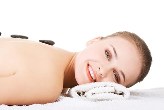 Beauty woman relaxing in spa. Stone massage. Isolateed.