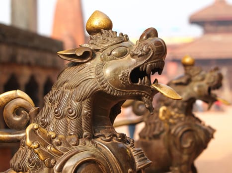 bronze lion in temple in Nepal