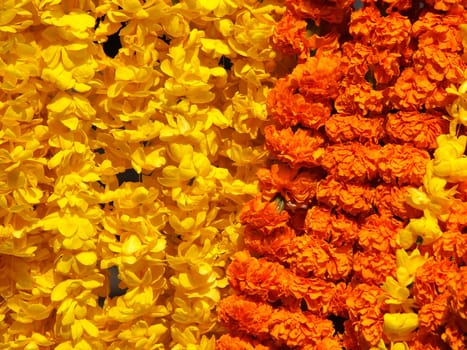 orange and yellow floral arrangement for holi festival and religious offerings in india.